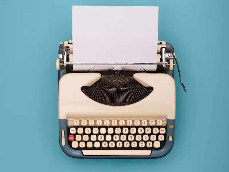 An old school typewriter with a blue background